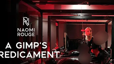 Latex-Gimp im Hodenflaschenzug